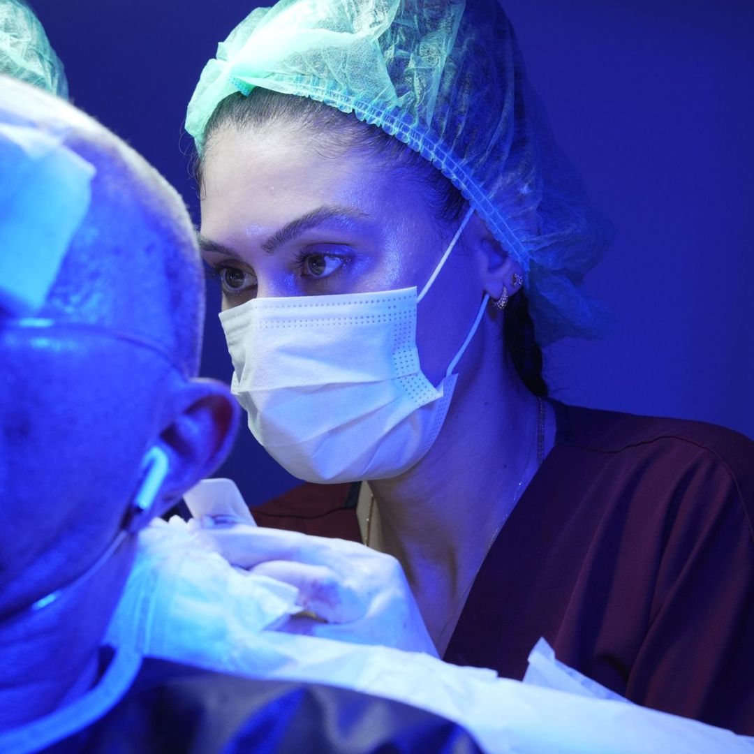Doctor performing hair transplant procedure